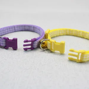 Soft plaid pet collar with quick-release plastic buckle and bell for cats and small dogs detail.