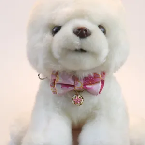 Close-up detail of cute pet collar with pink floral bowtie and sakura bell for cats and dogs.