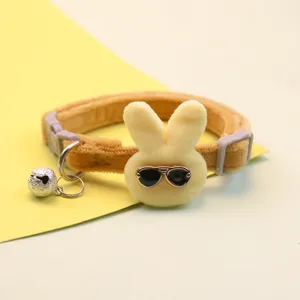 Plush cat dog collar with cute rabbit head and bell, soft velvet pet neck strap accessory.