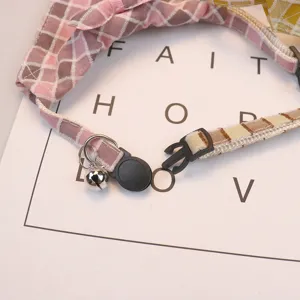 Cute plaid pet collar with bow and bell, soft polyester cotton cat dog necklace accessory.