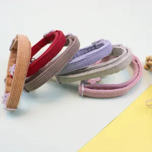 Corduroy pet collar with cute bell and flower, adjustable safety buckle for cats and dogs.
