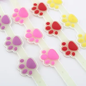 Colorful luminous pet collar with cute paw print design, glow in the dark safety strap for cats.