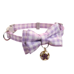 Purple plaid pet collar detail showing cute bow and decorative flower bell for cats dogs.