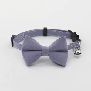 Purple pet cat dog collar with cute bowknot and bell adjustable stylish accessory for pets.