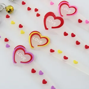 Cute translucent silicone pet collar with heart charms and metal bell detail for cats and dogs