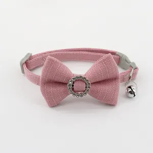 Detailed view of the pink pet collar featuring a cute fabric bow and sparkly rhinestone ring.