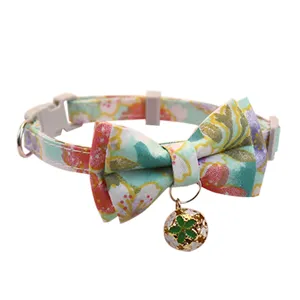 Floral pet collar with bow tie and bell detail, cute floral neck strap for cats and small dogs.