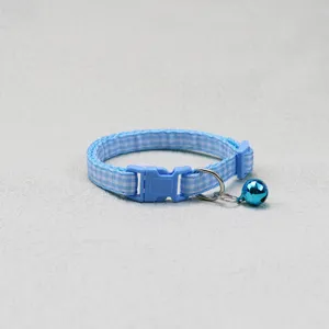 Blue plaid pet collar detail featuring soft woven fabric, safety buckle, and a cute blue bell.