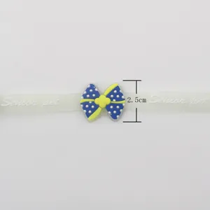 Luminous pet collar detail view showing the cute bowknot design and 2.5cm width sizing.