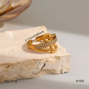 Gold titanium steel ring with sparkling cubic zirconia, stylish geometric open design for women.