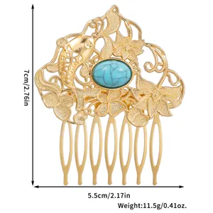 Detailed view of vintage alloy hair comb with blue resin stone, fish and floral design.