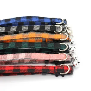 Detailed view of colorful plaid pet bell collars for cats and dogs, adjustable design.