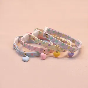 Detailed view of cute heart pendant pet collar with pastel print and adjustable safety buckle