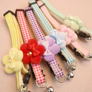 Cute plaid pet collar with plush flower and bow, featuring a bell for cats and small dogs.