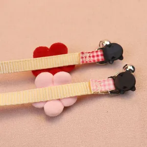 Cute plush flower pet collar with bell, yellow webbing strap, safety buckle, cat dog accessory.