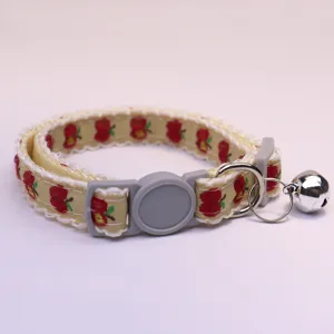 Cute apple print pet collar with bell, vintage lace design for cats and small dogs detail.