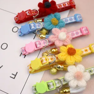 Floral cat collar with safety buckle and bell, cute puppy neck strap pet accessory detail.