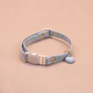 Cute blue heart pattern cat collar detail shot, featuring a sweet heart pendant and safety buckle.