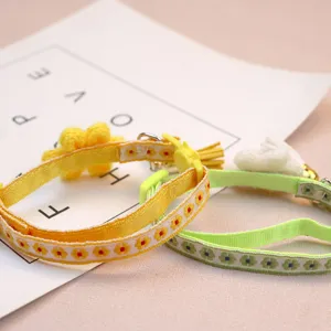 Cute floral pet collar detail with safety buckle and bell, charming accessory for cats dogs.