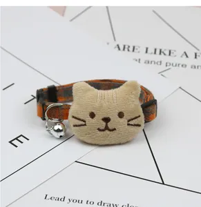 Cute plush cat head pet collar with bell adjustable kitten necklace detail display.