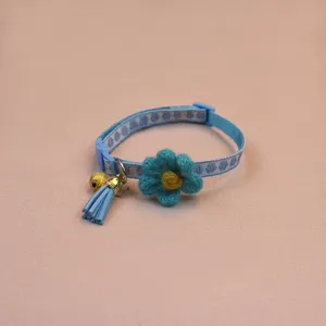 Blue pet collar with knitted flower bell and tassel for cats and dogs detail view