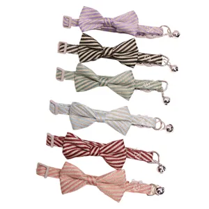 Cute striped pet cat collar with bowtie and bell, adjustable safe buckle accessory for dogs.