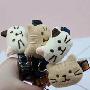 Cute plush cat pet collar with bell and adjustable strap, perfect for cats and dogs.