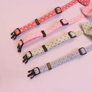 Detailed view of cute pet plaid collar with adjustable buckle and bow tie for cats and dogs.
