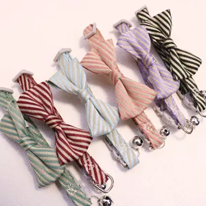 Colorful striped pet bow tie collar with bell and safety buckle for cute cats and dogs.