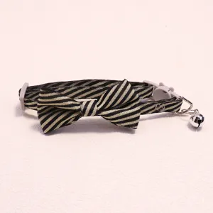 Striped pet cat collar with cute bow tie and bell, adjustable safety design for small pets.