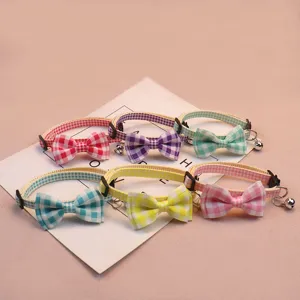 Cute plaid pet collar with bow and bell, adjustable safety buckle for cats and small dogs.