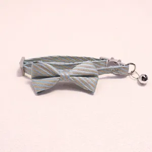 Exquisite striped pet collar with bow tie and bell detail, soft and comfortable for cats.