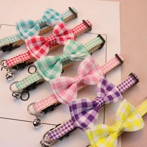 Cute plaid bow pet collar with small bell for cats and small dogs, vibrant colors, safe and adjustable.