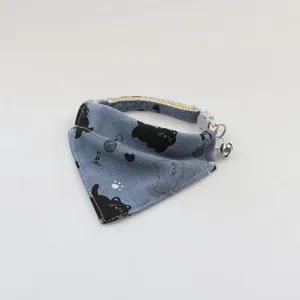 Cute pet bandana cat bib with bell and cartoon print, perfect for small dogs and cats detail.