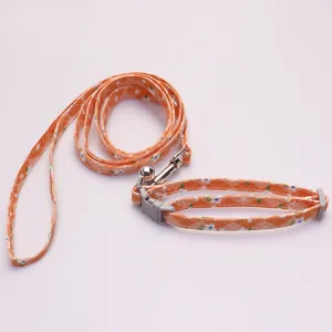 Orange floral pet collar and leash set for small dogs and cats, durable and stylish walking rope.
