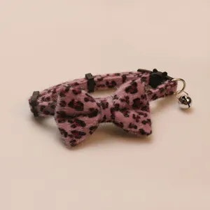 Close-up detail of the cute pink leopard print plush bow pet collar with a small bell.
