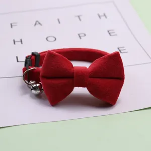 Red suede cat collar with bow tie and bell, adjustable velvet pet neck strap for small dogs.
