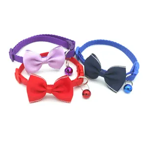 Cute pet collar with bow and bell for small cats and dogs, adjustable nylon neck strap daily use.