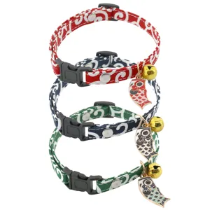 Japanese style pet cat collar with cute carp bell design, safe and durable kitten accessory.