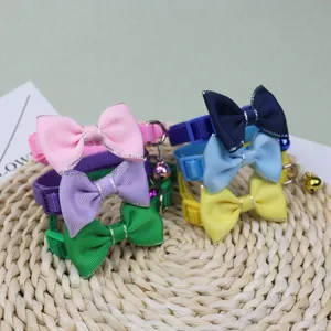 Colorful pet collar with cute bow and bell for cats and small dogs, adjustable design.