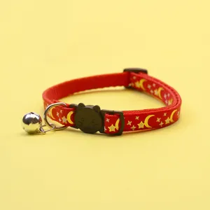 Red pet collar featuring gold moon and star print, black cat buckle, and cute bell detail.