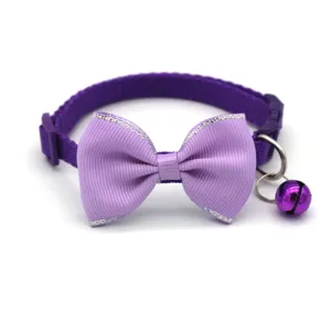 Purple cat collar with bow tie and bell, adjustable safety strap for kittens and puppies.