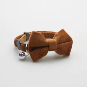 Brown suede pet collar with cute bow tie, metal bell and secure buckle for cats and dogs.