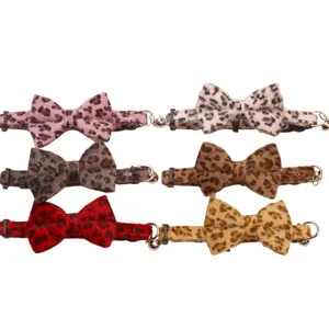 Cute leopard print pet collar with plush bow, fashionable neck accessory for cats and dogs.