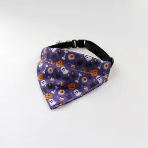 Halloween pet bandana collar detail shot, featuring cute ghost and pumpkin print with a bell.