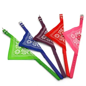 Detailed view of colorful pet bandana collars with paisley patterns and D-rings for small dogs.