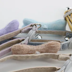 Cute pet collar with knitted bone charm and PU leather strap, ideal for cats and small dogs.