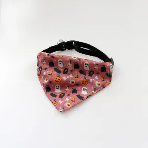 Close-up detail of Halloween pet bandana with cute ghost pumpkin print and black collar strap.