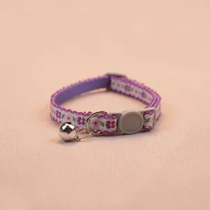 Floral pattern pet collar with safety buckle and bell, perfect for cats and small dogs.