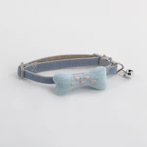 Cute pet cat dog collar with soft plush bone pendant and bell, stylish blue fabric strap.